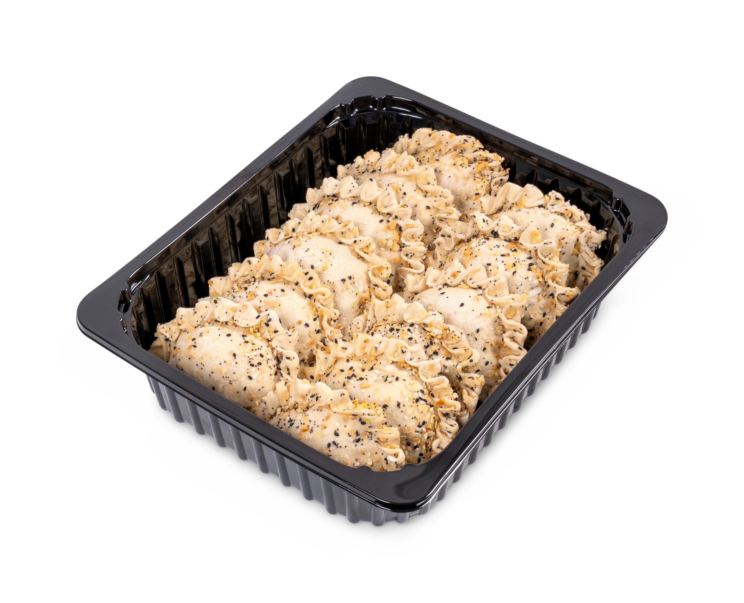 Tray of raw empanadas with seasoning